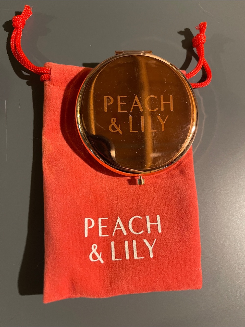 Peach & Lily Gold Compact Mirror in Coral Pouch